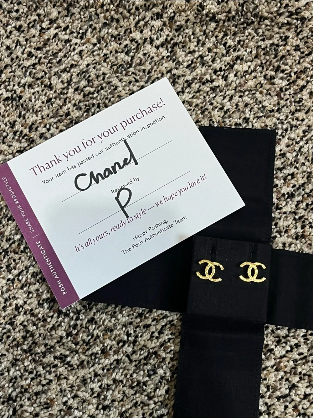 CHANEL Gold Interlocking CC Stud Earrings on Black